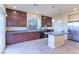 Eat-in kitchen featuring stainless steel appliances, granite countertops, and dark wood cabinets at 5350 Tulip Hill Ave, Las Vegas, NV 89141