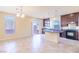 Eat-in kitchen featuring granite countertops, stainless appliances, and dark wood cabinets at 5350 Tulip Hill Ave, Las Vegas, NV 89141