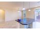 Kitchen featuring granite countertops, pendant lighting, and an eat-in area at 5350 Tulip Hill Ave, Las Vegas, NV 89141