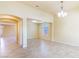 Bright living room with tile floors, neutral paint, chandelier and large windows, perfect for relaxing at 5350 Tulip Hill Ave, Las Vegas, NV 89141