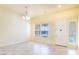 Bright Living room with tile floors, neutral paint, chandelier and large windows, perfect for relaxing at 5350 Tulip Hill Ave, Las Vegas, NV 89141