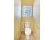 Compact powder room with a toilet, tiled floor, and a window for natural light at 5350 Tulip Hill Ave, Las Vegas, NV 89141