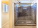This shower features a glass enclosure and built-in bench at 5350 Tulip Hill Ave, Las Vegas, NV 89141