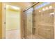 Bathroom shower with glass door, tiled surround, and recessed lighting at 5350 Tulip Hill Ave, Las Vegas, NV 89141
