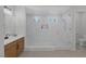 Lovely main bathroom with modern touches including double sinks and a pristine glass shower at 6333 Orto Vaso Ave, Las Vegas, NV 89131
