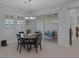 Dining area with sliding glass door, views of the covered patio, and plantation shutters at 6333 Orto Vaso Ave, Las Vegas, NV 89131
