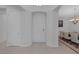 Bright foyer with neutral tile flooring and view to the dining room at 6333 Orto Vaso Ave, Las Vegas, NV 89131