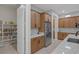 Gourmet kitchen featuring stainless steel appliances, pantry, and sleek granite countertops, creating a chef-inspired culinary space at 6333 Orto Vaso Ave, Las Vegas, NV 89131