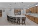 Spacious kitchen featuring a massive island with seating and modern appliances, perfect for cooking and entertaining at 6333 Orto Vaso Ave, Las Vegas, NV 89131