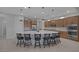 Large kitchen island with seating, stainless steel appliances, and ample counter space for food preparation and casual dining at 6333 Orto Vaso Ave, Las Vegas, NV 89131