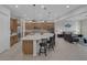 Spacious open-concept kitchen featuring large island, granite countertops, and a seamless transition to the inviting living area at 6333 Orto Vaso Ave, Las Vegas, NV 89131