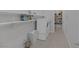 Well-organized laundry room featuring modern appliances and shelving for supplies at 6333 Orto Vaso Ave, Las Vegas, NV 89131