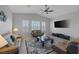 Spacious living room filled with natural light from the large windows with plantation shutters at 6333 Orto Vaso Ave, Las Vegas, NV 89131