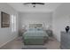 The bedroom is adorned with a beautiful bed set, end tables and neutral walls that create a peaceful retreat at 6333 Orto Vaso Ave, Las Vegas, NV 89131