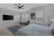 This bedroom offers a large layout, windows, and neutral walls, making it a serene space at 6333 Orto Vaso Ave, Las Vegas, NV 89131