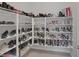 Spacious walk-in closet with floor-to-ceiling shoe racks, offering ample storage for an extensive footwear collection at 6333 Orto Vaso Ave, Las Vegas, NV 89131