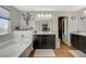 Bright bathroom featuring stylish vanity and soaking tub, plus walk-in closet access at 7018 Hunts Corner St, Las Vegas, NV 89166