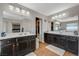 Bright double vanity bathroom featuring stylish vanities and walk-in closet access at 7018 Hunts Corner St, Las Vegas, NV 89166