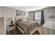 Cozy bedroom featuring stylish decor, a comfortable bed, and a well-lit window, creating a relaxing retreat at 7018 Hunts Corner St, Las Vegas, NV 89166