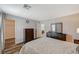 Tranquil bedroom with a wardrobe, dresser, and an ensuite bathroom entrance at 7018 Hunts Corner St, Las Vegas, NV 89166