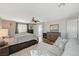 Spacious main bedroom featuring ensuite bathroom access and a relaxing lounge area at 7018 Hunts Corner St, Las Vegas, NV 89166