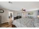 Spacious main bedroom featuring ensuite bathroom access and a relaxing lounge area at 7018 Hunts Corner St, Las Vegas, NV 89166