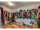 Walk-in closet with ample hanging space and storage for clothes and accessories at 7018 Hunts Corner St, Las Vegas, NV 89166