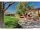 Picturesque community park with mature trees, a picnic table, and inviting green spaces at 7018 Hunts Corner St, Las Vegas, NV 89166