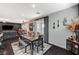 Comfortable dining area with a view of the living room and access to the outdoors at 7018 Hunts Corner St, Las Vegas, NV 89166