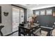 Stylish dining area with modern decor and sliding glass doors to the backyard at 7018 Hunts Corner St, Las Vegas, NV 89166