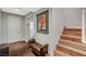 Inviting foyer featuring hardwood floors, staircase, and stylish decor at 7018 Hunts Corner St, Las Vegas, NV 89166
