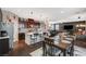 Open kitchen with granite countertops, stainless steel appliances, and island seating at 7018 Hunts Corner St, Las Vegas, NV 89166