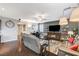 Spacious living room with modern furnishings, hardwood floors, and a cozy ambiance at 7018 Hunts Corner St, Las Vegas, NV 89166