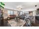 Spacious living room with comfortable seating, open layout, and abundant natural light at 7018 Hunts Corner St, Las Vegas, NV 89166