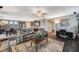 Open concept living room with dining area and kitchen, perfect for entertaining at 7018 Hunts Corner St, Las Vegas, NV 89166