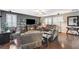 Inviting living room featuring hardwood floors, comfortable seating, and stylish decor at 7018 Hunts Corner St, Las Vegas, NV 89166