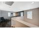 Cozy loft area with desk, reading chair, and lots of natural light, perfect for a home office at 7018 Hunts Corner St, Las Vegas, NV 89166