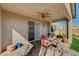 Relaxing patio with an outdoor dining set, and views of the landscaped backyard, for serene outdoor living at 7018 Hunts Corner St, Las Vegas, NV 89166