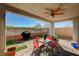 Inviting covered patio featuring outdoor furniture, a ceiling fan, and views of the backyard at 7018 Hunts Corner St, Las Vegas, NV 89166
