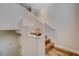 Unique staircase design with half wall, wooden steps, and landing with stylish display shelf at 7018 Hunts Corner St, Las Vegas, NV 89166