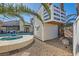 Backyard view showcasing the pool, spa, and custom-built treehouse, creating a fun and relaxing outdoor space at 720 Camino La Paz, Henderson, NV 89012