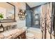 Charming bathroom featuring stylish tile, built-in shelving, and a shower-tub combination at 720 Camino La Paz, Henderson, NV 89012