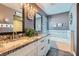 Beautiful bathroom featuring dual sinks with granite countertops and a relaxing soaking tub at 720 Camino La Paz, Henderson, NV 89012