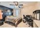 Comfortable bedroom featuring a ceiling fan, accent wall and space for a study desk at 720 Camino La Paz, Henderson, NV 89012