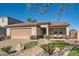 Charming single-story home featuring a tile roof, desert landscaping, and inviting front porch at 720 Camino La Paz, Henderson, NV 89012
