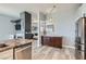 Modern kitchen featuring granite countertops, stainless steel appliances, and dark wood cabinets at 720 Camino La Paz, Henderson, NV 89012