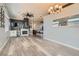 Spacious living room featuring a fireplace, wet bar, recessed lighting, and wood-look tile flooring at 720 Camino La Paz, Henderson, NV 89012