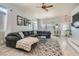 Cozy living room featuring a large sectional sofa, area rug, and plenty of natural light at 720 Camino La Paz, Henderson, NV 89012