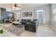 Bright living room featuring a large sectional sofa, area rug, and plenty of natural light at 720 Camino La Paz, Henderson, NV 89012