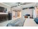 Spacious main bedroom with decorative beamed ceiling, wood-look floors, and ensuite bath at 720 Camino La Paz, Henderson, NV 89012